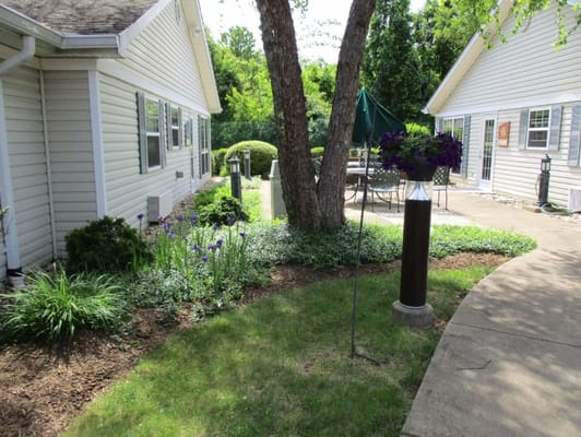 Outdoor garden area with seating and landscaping