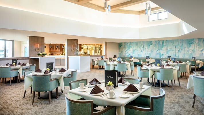 Elegant dining room setup with tables and chairs