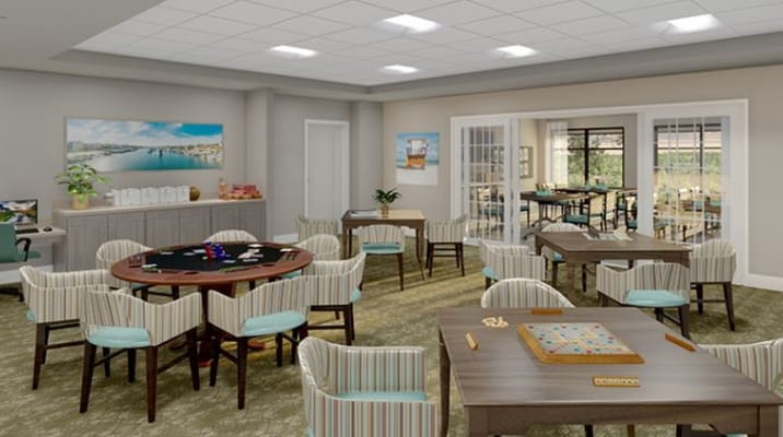 Common area with game tables in a bright room