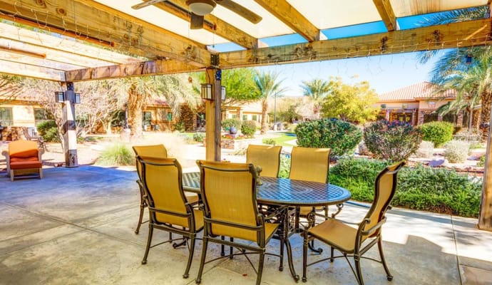 Outdoor dining area with table and chairs