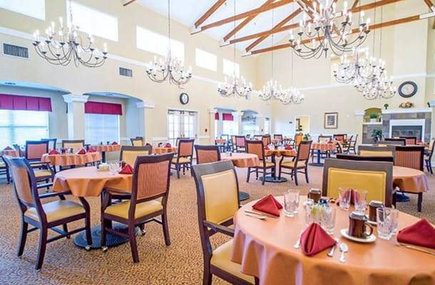 Spacious dining room with elegant decor and tables set for meals