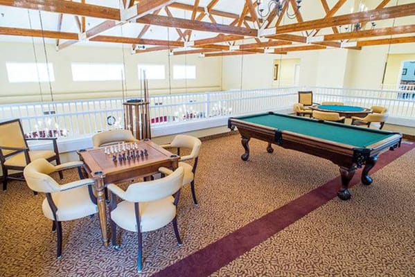 Bright common area with chess and pool tables