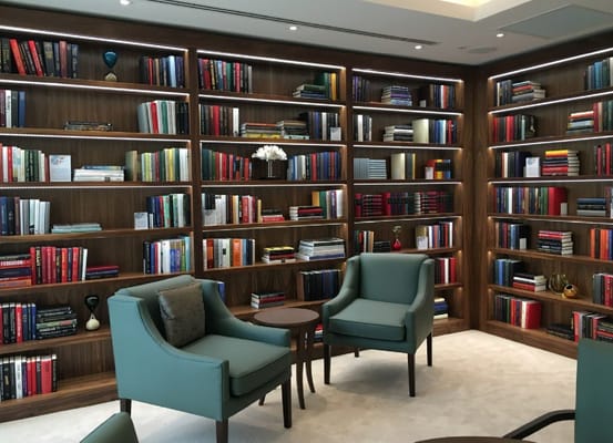 Cozy library area with bookshelves and seating