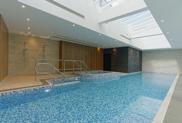 Indoor swimming pool with modern design and natural light