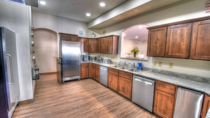 Well-equipped kitchen area with wooden cabinets