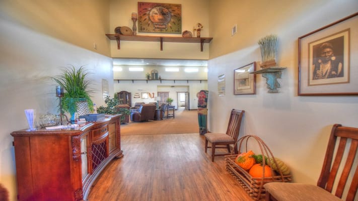 Bright lobby area with chairs and decorative items