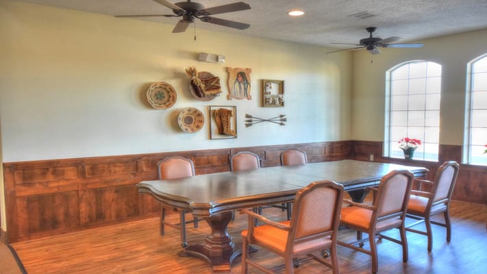 Bright dining area with wooden furniture and decorations