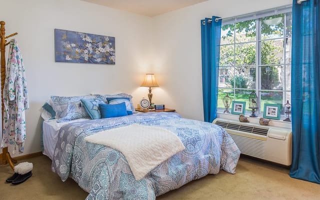 Cozy resident room with a bed and natural light
