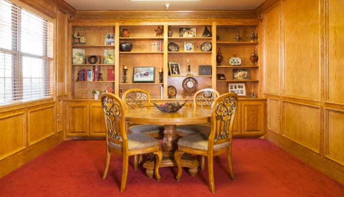 Cozy common area with wooden furniture and shelves