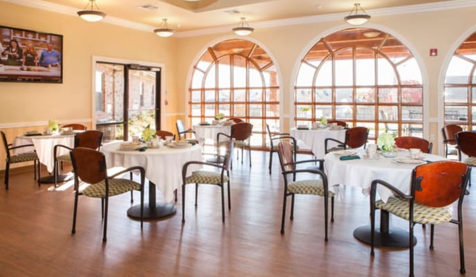 Dining area with tables and large windows