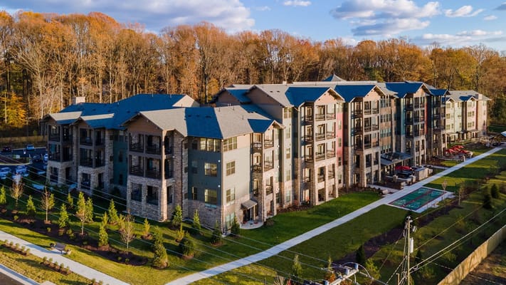 Aerial view of a modern assisted living building with landscaping