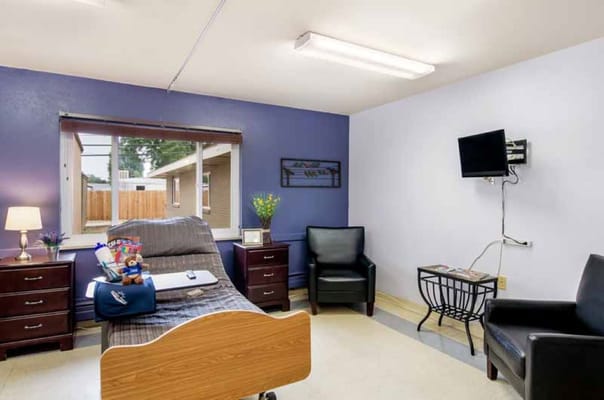 Comfortable resident room with a window and seating area