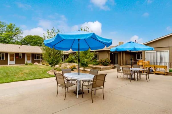 Outdoor seating area with umbrellas and tables