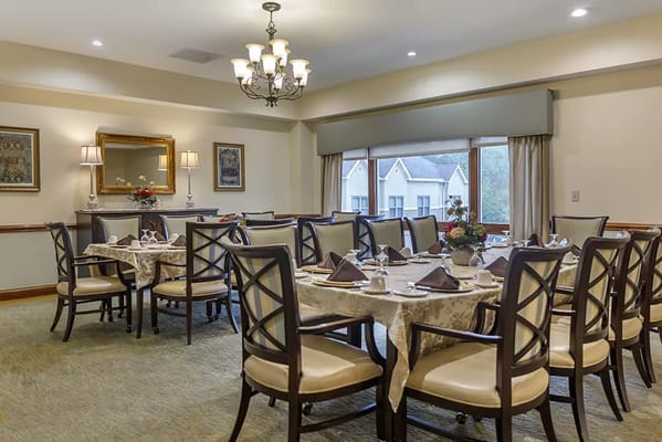 Elegant dining room setup with tables and chairs
