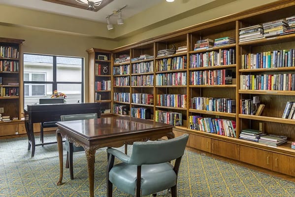 Cozy library with bookshelves and reading tables