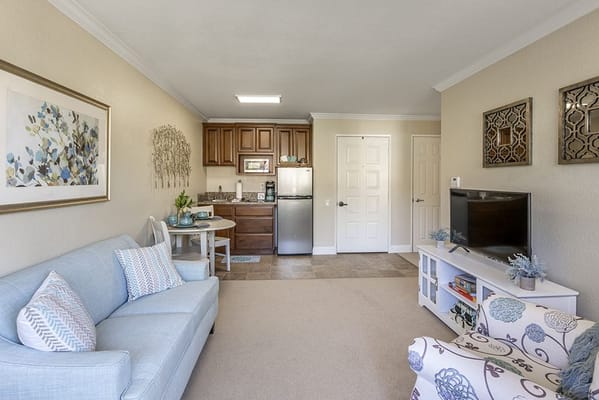 Cozy living space with kitchen area in a senior facility