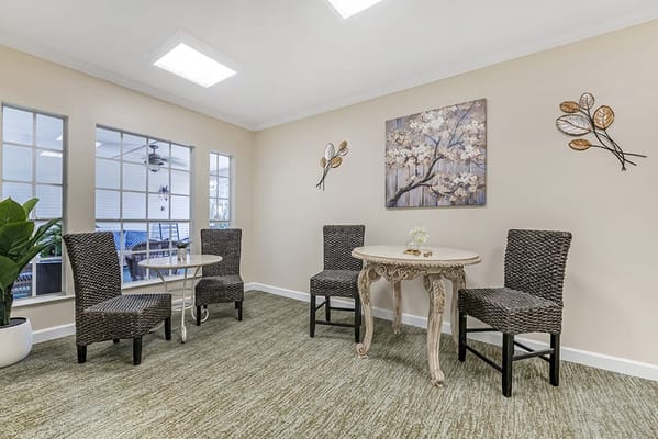 Bright common area with seating and decorative art