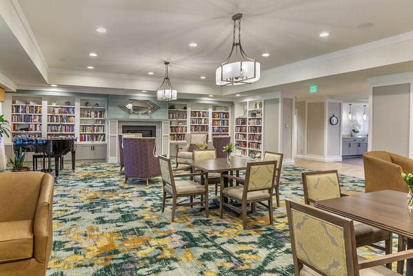 Bright and welcoming lounge area with bookshelves