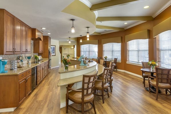 Bright and welcoming common area with kitchen and seating