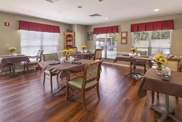 Bright dining room with flower centerpieces