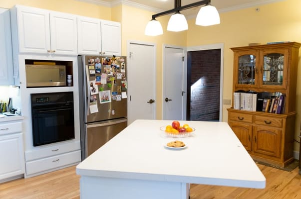 Bright kitchen space with fruits and cookies on the countertop