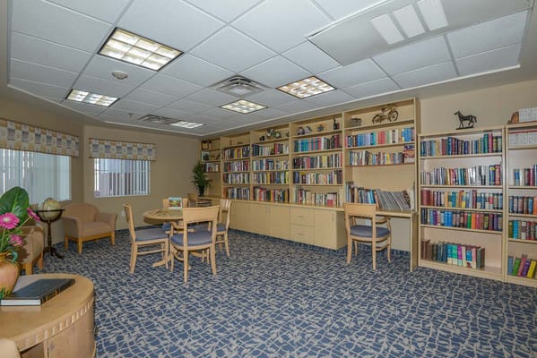 Bright interior library with bookshelves and seating