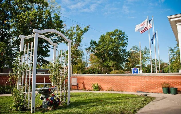 Beautiful outdoor garden area with facility flags