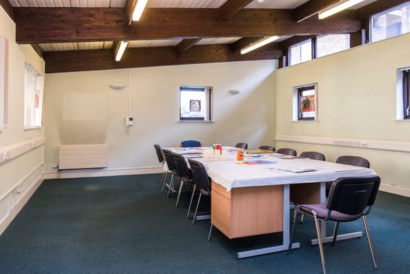 Interior of a meeting room with a table and chairs