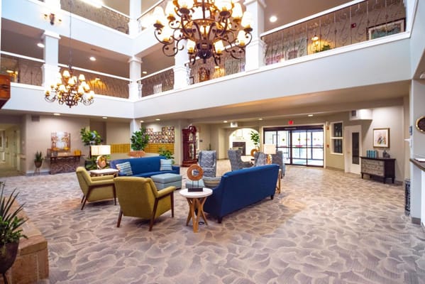 Common area with seating and decor in a senior living facility