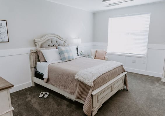 A well-furnished private resident room with natural light