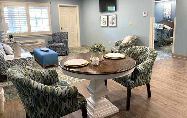 Interior of a resident room with dining table and chairs