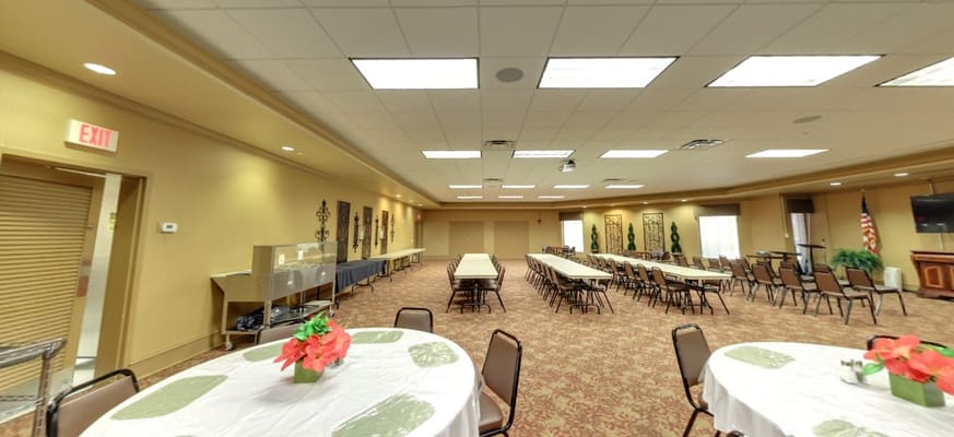 Common area with tables and chairs set up for events