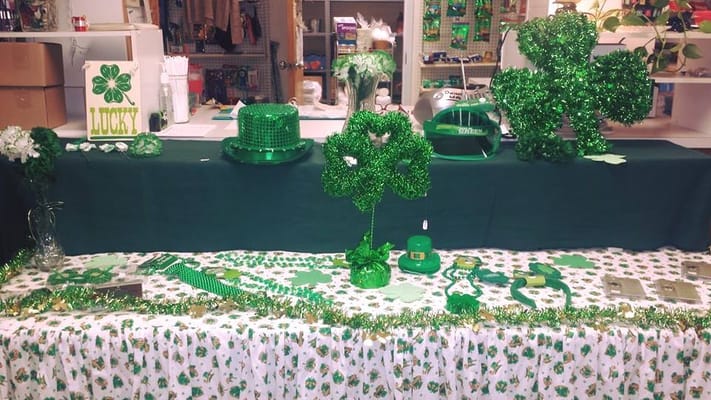 Decorative green items for St. Patrick's Day including shamrocks and a green hat.