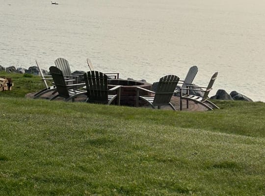 Outdoor fire pit area by the water
