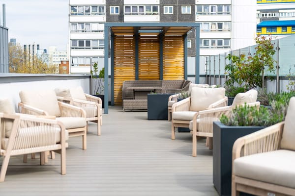 Rooftop terrace with seating and greenery