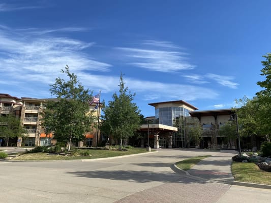 Exterior view of Edgewater facility with landscaping and blue sky