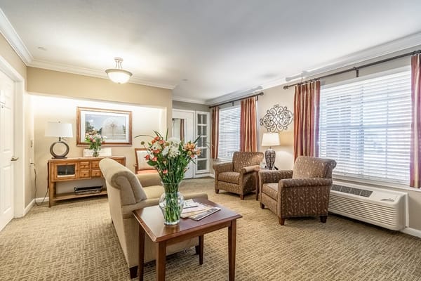 Cozy common area with comfortable seating and flowers