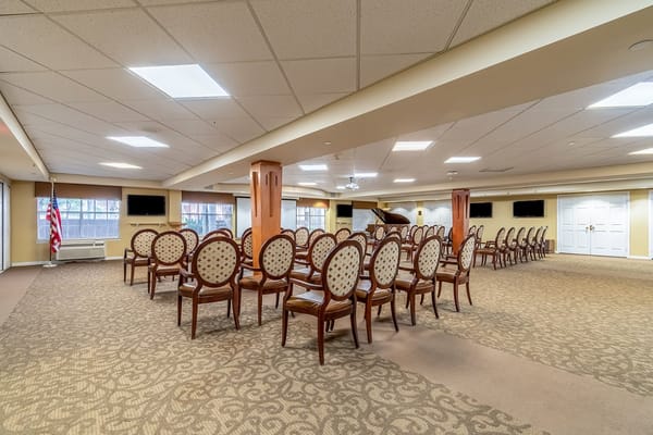 Common area with arranged chairs for events