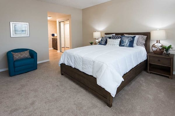 Private resident room with a bed and seating area