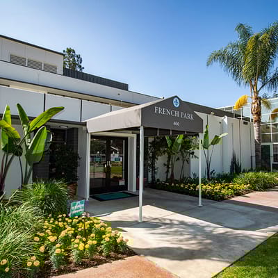 Entrance of French Park Care Center with vibrant flowers