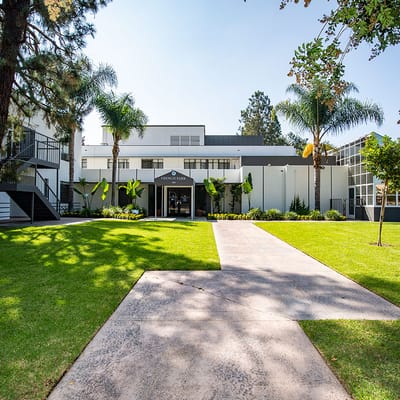 Building exterior of French Park Care Center with landscaping