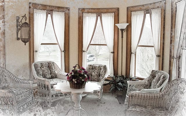 Comfortable seating area with wicker chairs and a table
