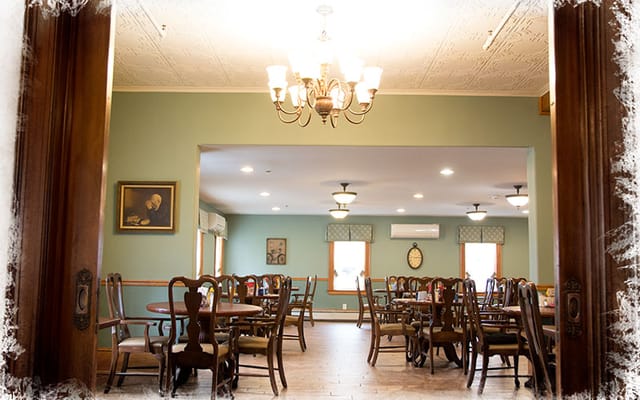 Cozy dining area with wooden tables and chairs