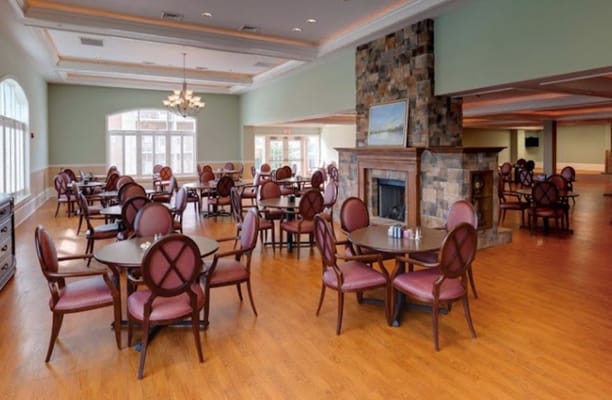 Dining area with tables and chairs in a bright interior