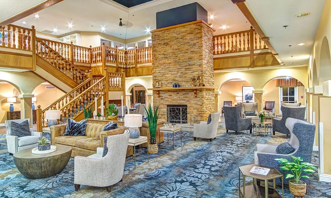 Interior view of a spacious common area with seating and staircase