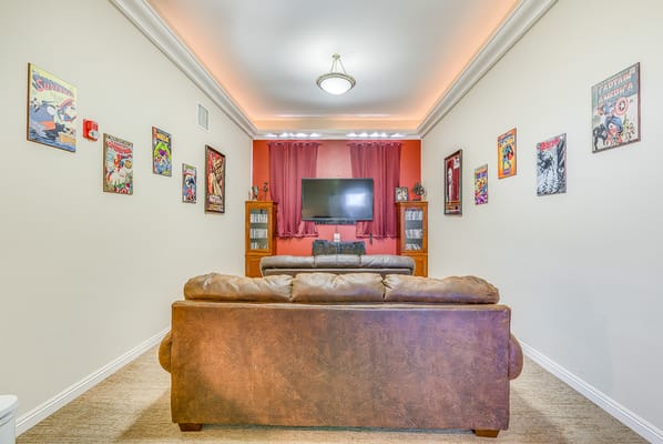 Bright common area with comfortable seating and wall art