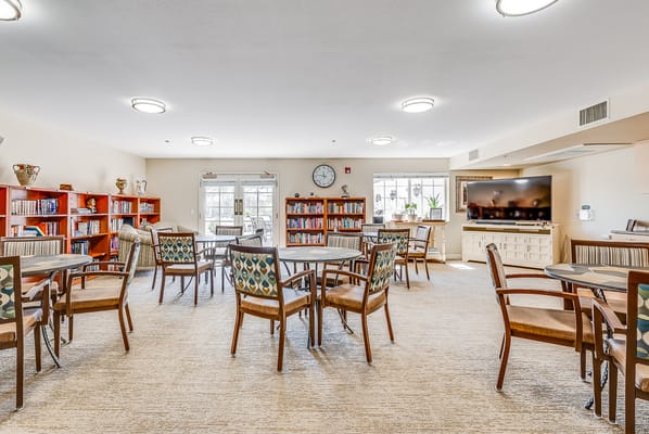 Bright common area with bookshelves and seating