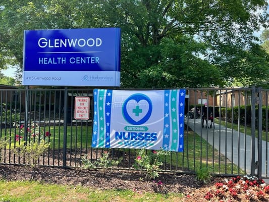 Exterior view of Glenwood Health Center with a banner