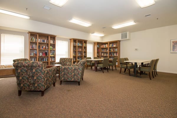 Interior view of a library with bookshelves and seating