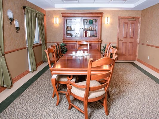 Interior dining room with wooden table and chairs